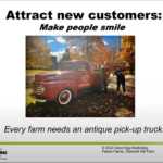 screenshot of powerpoint slide that says "Attract new customers: make people smile" with a photo of customers posing in front of an antique truck